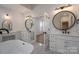 Bright bathroom boasts a soaking tub, double vanities, and modern fixtures for a spa-like experience at 2321 Ivey Church Rd, Maiden, NC 28650