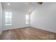 Bright bedroom with large windows, vaulted ceilings, and light wood flooring offers a tranquil retreat at 2321 Ivey Church Rd, Maiden, NC 28650