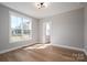 Bright bedroom with hardwood floors, large windows with view, and fresh paint at 2321 Ivey Church Rd, Maiden, NC 28650