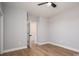 Neutral bedroom with light wood floors, open doors, and ceiling fan at 2321 Ivey Church Rd, Maiden, NC 28650