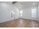 Bright bedroom features vaulted ceilings, wood beams, and an attached bathroom with walk in closet at 2321 Ivey Church Rd, Maiden, NC 28650