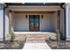 Charming entryway with brick steps, wood columns, and a double front door at 2321 Ivey Church Rd, Maiden, NC 28650