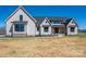 Stunning two-story modern farmhouse with white siding, black trim, and a well-manicured lawn at 2321 Ivey Church Rd, Maiden, NC 28650