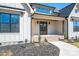 Inviting front porch with wood columns, brick accents, and a pathway leading to the front door at 2321 Ivey Church Rd, Maiden, NC 28650