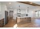 Modern kitchen with white cabinets, wood island, stainless steel appliances, and hardwood floors at 2321 Ivey Church Rd, Maiden, NC 28650