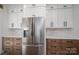 Elegant kitchen with stainless steel refrigerator, ample cabinetry, and designer finishes at 2321 Ivey Church Rd, Maiden, NC 28650