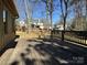 View of a wooden backyard deck showcasing the fenced-in yard at 300 Mcalway Rd, Charlotte, NC 28211