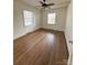 Spacious bedroom featuring hardwood floors and two windows for natural light at 300 Mcalway Rd, Charlotte, NC 28211