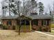Charming brick home with a covered porch and mature trees at 300 Mcalway Rd, Charlotte, NC 28211