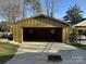 A spacious detached garage with ample parking and storage on a sunny day at 300 Mcalway Rd, Charlotte, NC 28211