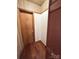 Hallway features hardwood floors, wallpapered ceiling, and built-in storage at 300 Mcalway Rd, Charlotte, NC 28211