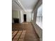 Well-lit living room featuring hardwood floors and a cozy fireplace at 300 Mcalway Rd, Charlotte, NC 28211