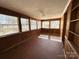 Charming sunroom featuring built in shelving, wood paneling and lots of windows at 300 Mcalway Rd, Charlotte, NC 28211