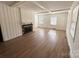 Bright and airy living room with hardwood floors and a brick fireplace at 300 Mcalway Rd, Charlotte, NC 28211