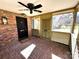 Charming screened-in front porch with brick floor and black front door at 300 Mcalway Rd, Charlotte, NC 28211