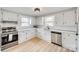 Bright kitchen featuring stainless steel appliances, ample cabinet space, and quartz countertops at 357 Chestnut St, Rock Hill, SC 29730