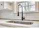 Close-up of the sink, showcasing quartz countertops and a modern black faucet fixture at 357 Chestnut St, Rock Hill, SC 29730