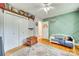 Well-decorated bedroom with hardwood floors, a closet, and green accent wall with a toddler bed at 362 Ranson Rd, Lancaster, SC 29720