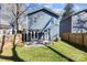 Private backyard with a pergola-covered patio, green lawn, and wood fence at 4114 Rutgers Ave, Charlotte, NC 28206