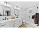 Beautiful bathroom with dual sinks, modern fixtures, and a glass-enclosed shower at 4114 Rutgers Ave, Charlotte, NC 28206