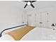 Spacious bedroom featuring a black bed frame, closet, and bright windows at 4114 Rutgers Ave, Charlotte, NC 28206