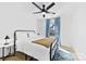 Bright bedroom featuring a black bed frame and bright window at 4114 Rutgers Ave, Charlotte, NC 28206