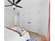 Bright bedroom featuring hardwood floors, a ceiling fan, and double door closet at 4114 Rutgers Ave, Charlotte, NC 28206