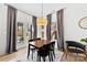 Cozy dining area with modern lighting, table and chairs and access to outdoor area at 4114 Rutgers Ave, Charlotte, NC 28206