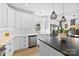 Contemporary kitchen with white cabinetry, stainless steel appliances, and sleek countertops at 4114 Rutgers Ave, Charlotte, NC 28206