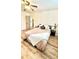 Bedroom with wood floors and modern ceiling fan, light and airy with neutral décor at 4342 Valeview Ln, Charlotte, NC 28269