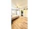 Spacious bedroom with light floors, a ceiling fan, and large closets with an ensuite bathroom at 4342 Valeview Ln, Charlotte, NC 28269