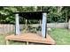 Cozy backyard gazebo with outdoor dining set, white drapes, and deck with a wooded backdrop at 4342 Valeview Ln, Charlotte, NC 28269
