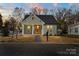 Charming single-story home with green siding and welcoming front porch at 501 Everette St, Monroe, NC 28112