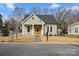 Charming single-story home with green siding and welcoming front porch at 501 Everette St, Monroe, NC 28112