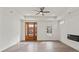 Bright living room featuring modern fireplace, tray ceiling, and hardwood floors at 501 Everette St, Monroe, NC 28112