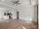 Open concept living and kitchen area with stainless appliances and modern finishes at 501 Everette St, Monroe, NC 28112