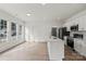Open-concept living room with large windows and bright interior paint at 501 Everette St, Monroe, NC 28112