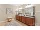 Spacious bathroom featuring double vanities, granite countertops, and elegant fixtures at 6141 Abergele Ln, Matthews, NC 28104