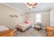 Cozy bedroom featuring neutral walls and a decorative chair in the corner at 6141 Abergele Ln, Matthews, NC 28104
