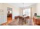 Dining area with wainscoting, view to kitchen and ample light at 6141 Abergele Ln, Matthews, NC 28104