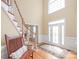 Bright foyer with hardwood floors, a staircase, and a decorative glass front door at 6141 Abergele Ln, Matthews, NC 28104