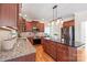 Modern kitchen with granite counters, island, and stainless steel appliances at 6141 Abergele Ln, Matthews, NC 28104