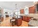 Open concept kitchen with a large island, granite countertops, and stainless steel appliances at 6141 Abergele Ln, Matthews, NC 28104