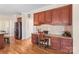 Open kitchen area featuring a built-in desk and stainless steel appliances at 6141 Abergele Ln, Matthews, NC 28104