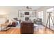 A bright and airy living room with hardwood floors, comfortable seating and a cozy fireplace at 6141 Abergele Ln, Matthews, NC 28104