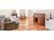 Cozy living room featuring wood floors and a charming writing desk at 6141 Abergele Ln, Matthews, NC 28104