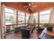 Cozy screened porch with comfortable seating and wood accents at 6141 Abergele Ln, Matthews, NC 28104