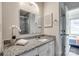 Bathroom featuring granite countertops, white cabinetry, and a shower at 6374 Windsor Gate Ln, Charlotte, NC 28215