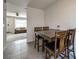 Dining area with tile floors and an open view of the living room at 6374 Windsor Gate Ln, Charlotte, NC 28215