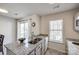 Kitchen featuring stainless steel double sink, granite countertop, and natural light at 6374 Windsor Gate Ln, Charlotte, NC 28215